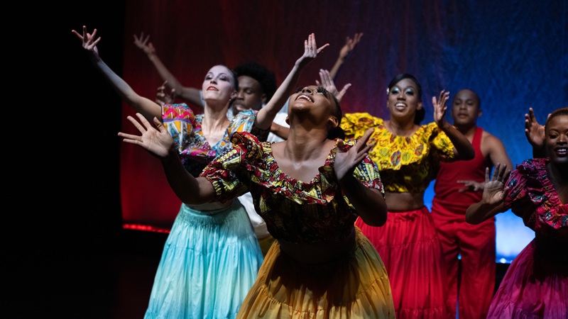 Dancer performing on stage at the African Heritage Cultural Arts Center