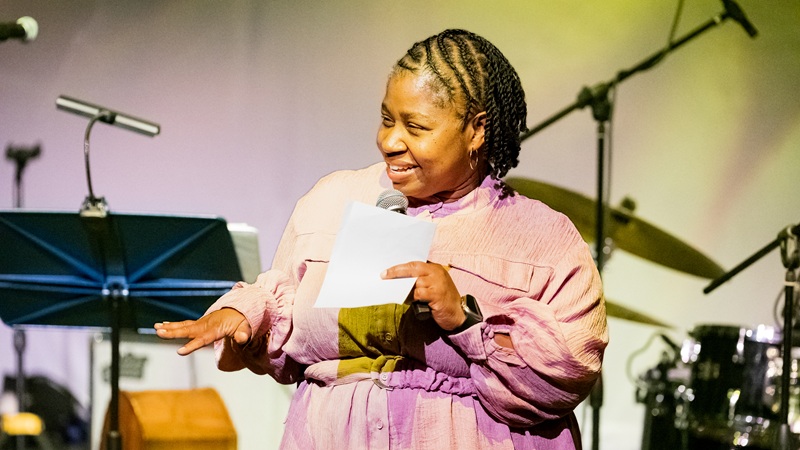 Woman on stage at the Marshall L. Davis, Sr. African Heritage Cultural Arts Center 