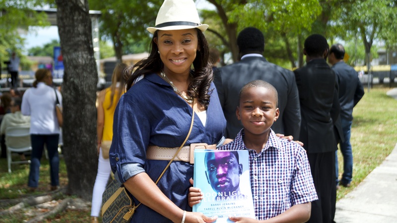 Woman posing with a young boy at an event at the Marshall L. Davis African Heritage Cultural Arts Center.